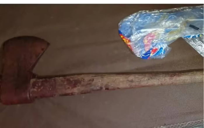 imagem colorida mae suspeita de matar filho com golpes de machado